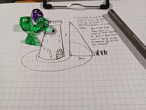 A photograph of a notebook page, where someone has doodled a castle tower with a simple moat surrounding it. Beside the tower is a triangle where two lengths of two sides are known, and one is marked as X. There is a group of adventurers standing at one of the corners of the triangle. Above them is a scribbling entailing tasks to solve the X to proceed. On the page, there is also a set of polyhedral dice and a pen. 